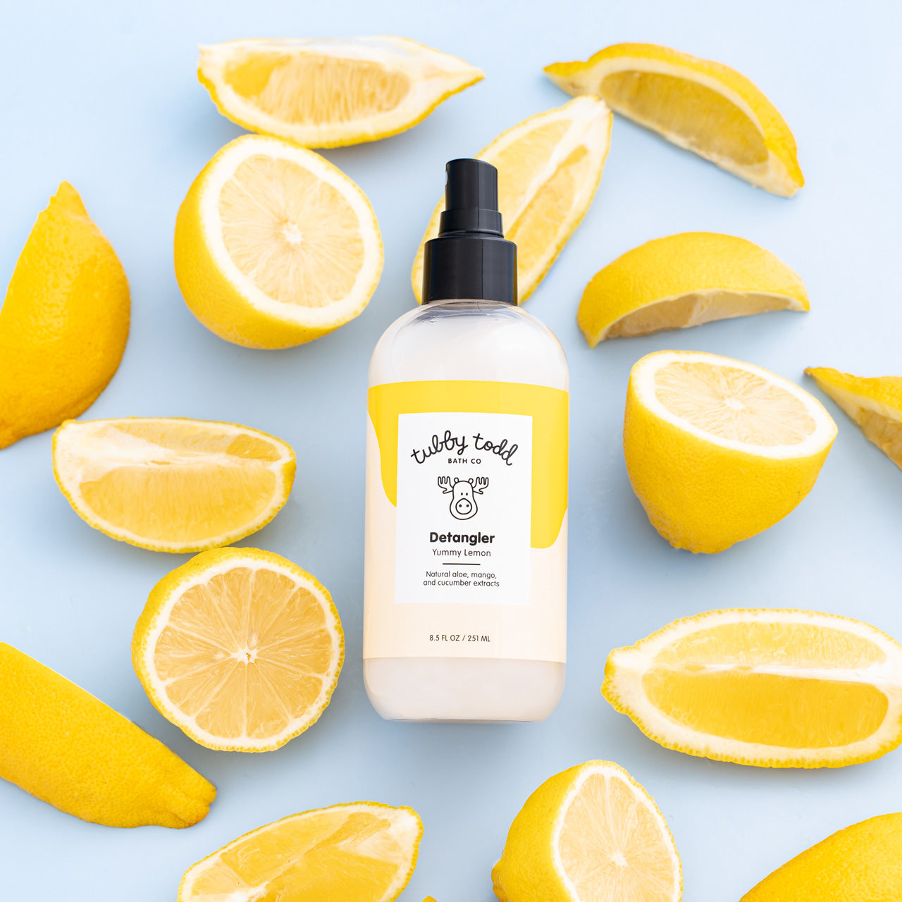 Detangler next to lemon wedges